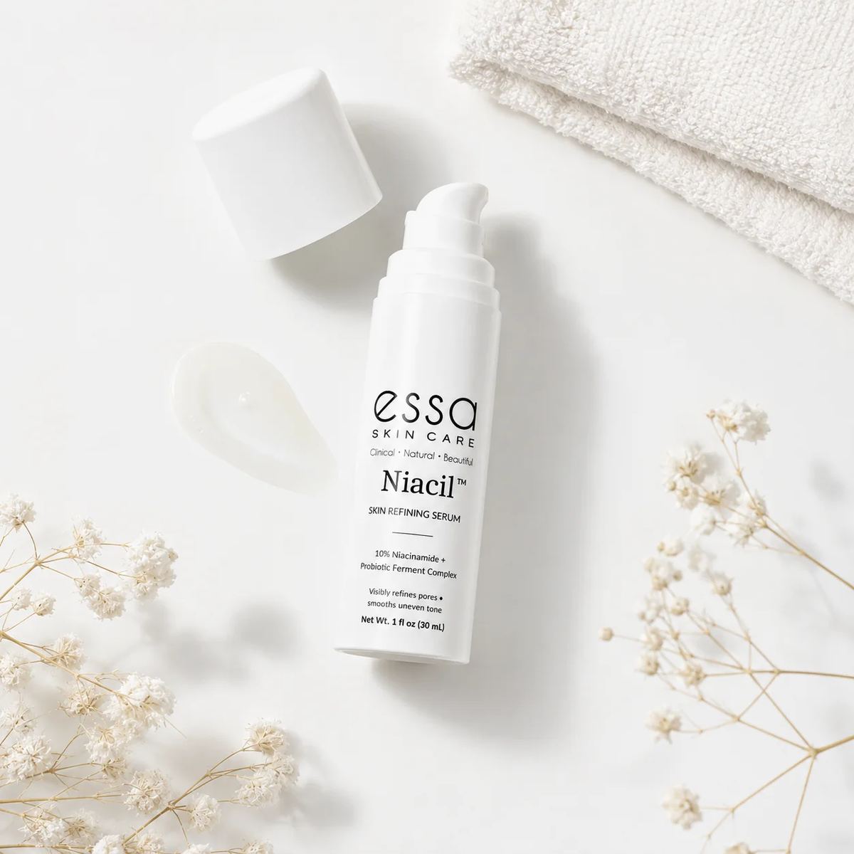 Niacil serum flat lay with flowers