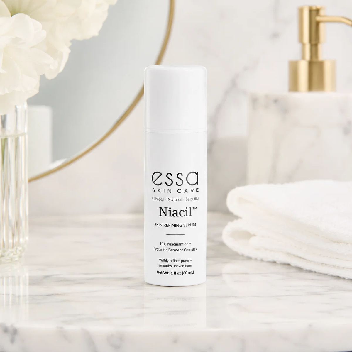 Niacil serum on marble bathroom counter