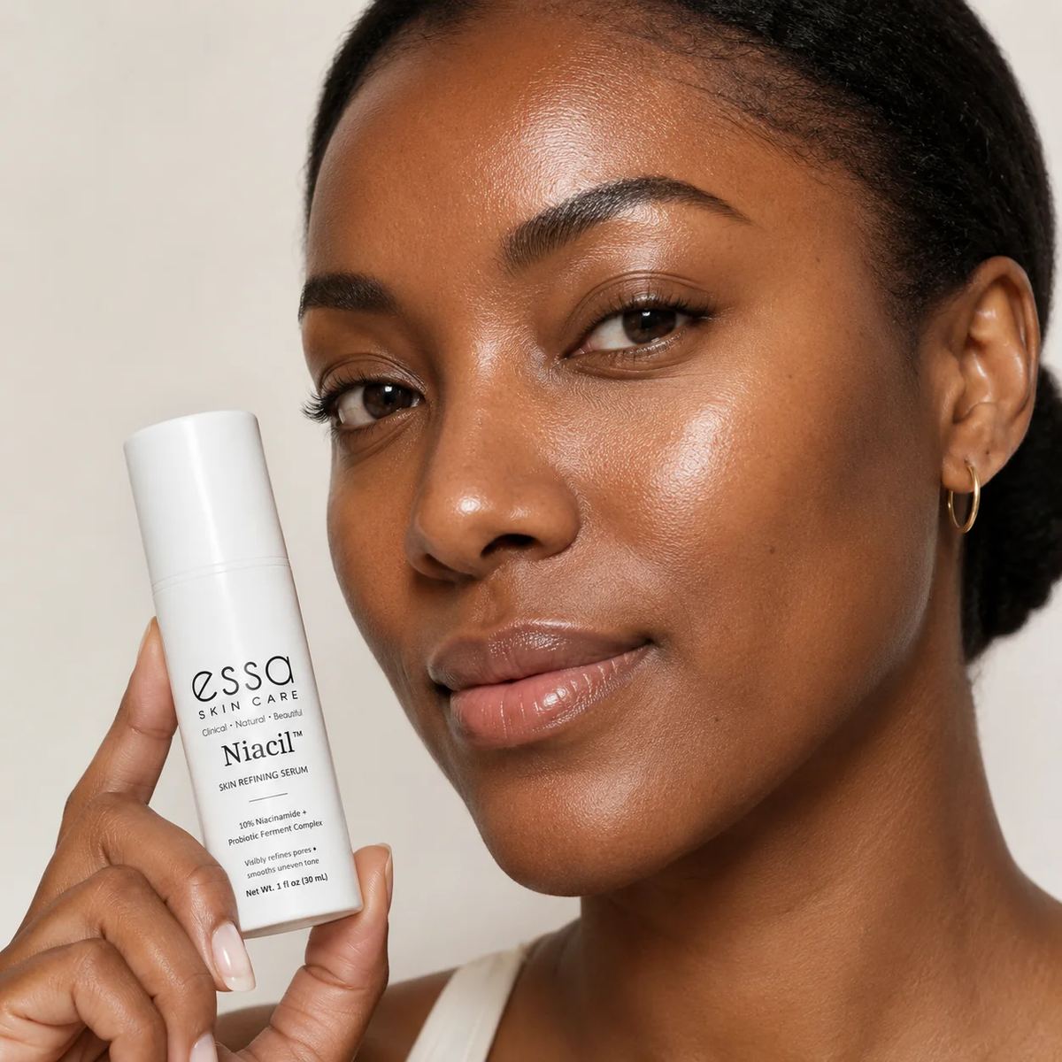 Woman holding Niacil serum
